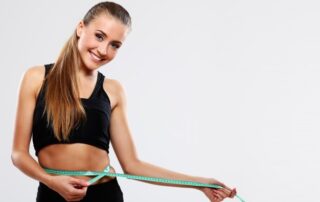 a woman is showing her weight loss journey after consuming medical marijuana