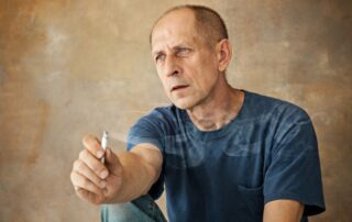 a senior citizen smoking a joint