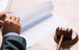 an eviction notice with a pen forcing a tenant to leave the house for using MMJ
