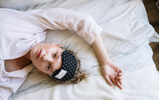 A person lying on their bed