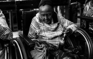 Elderly woman in a wheelchair.