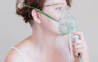 A woman having trouble breathing.