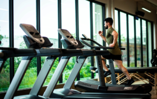 A man running on a gym treadmill