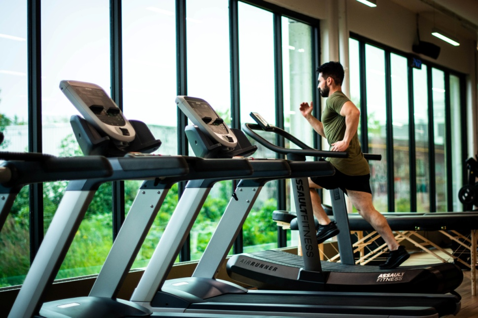 A man running on a gym treadmill